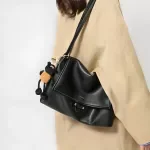 Elegant Leather Texture Shoulder Bag with Pendant